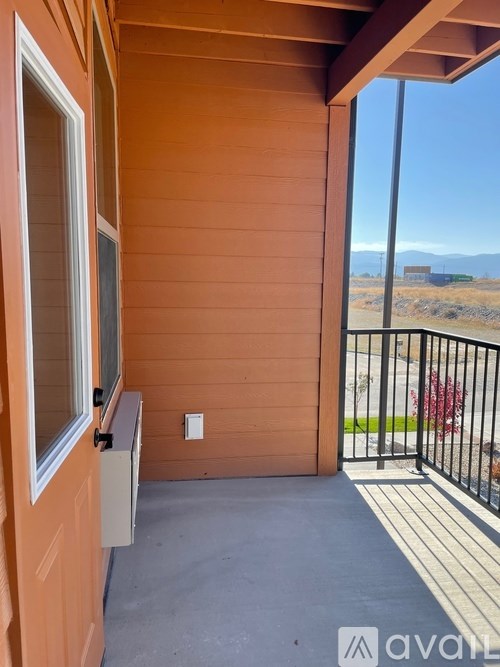 A balcony with a view of the outdoors.