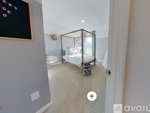 A bedroom with a bed and a chair in it.