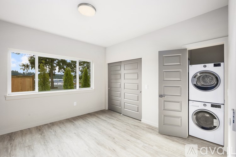 A laundry room with a washer and dryer in it.