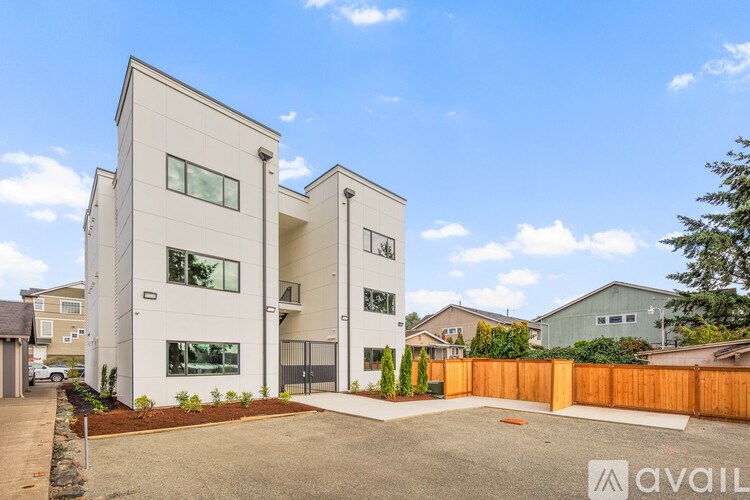 A modern two-story house with a garage is for sale.