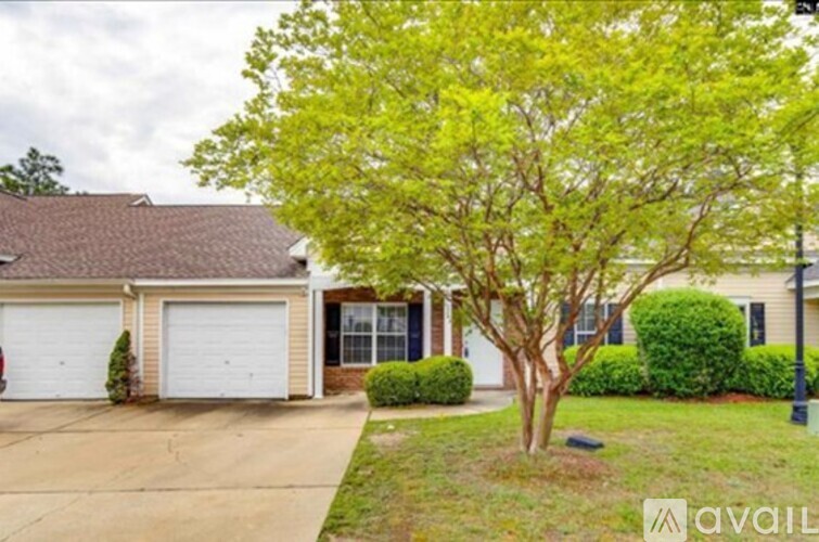A house with a tree in front of it.