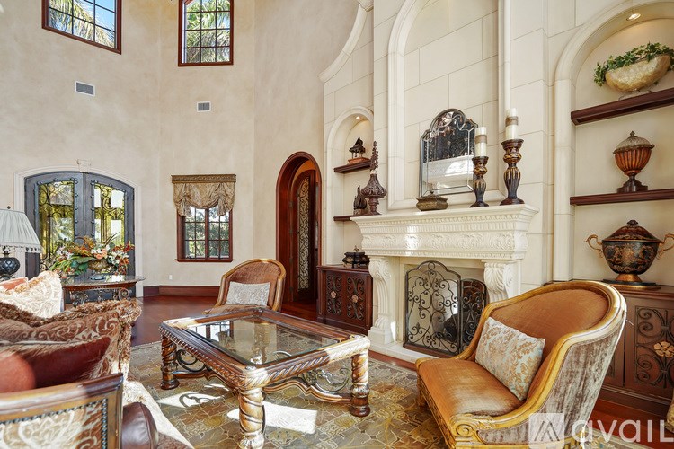 A living room with a fireplace and a chair.