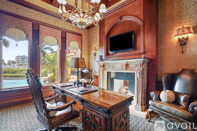 A room with a fireplace, a chair, and a television.