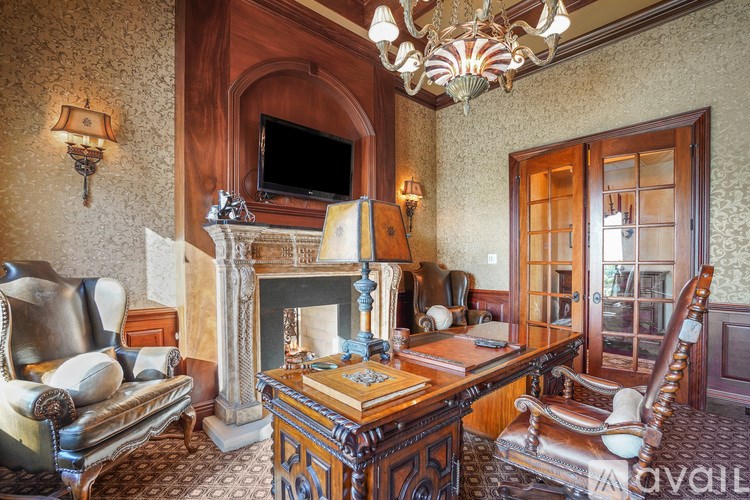 A room with a fireplace and a chair.