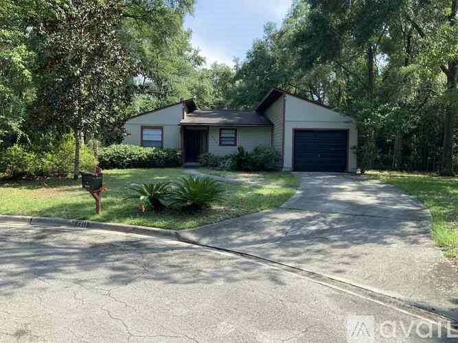 A house with a driveway and a garage door.