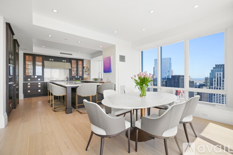 A modern dining room with a view of the city.