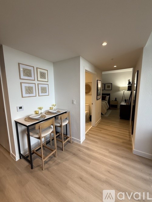 A dining area with a table and chairs is shown.