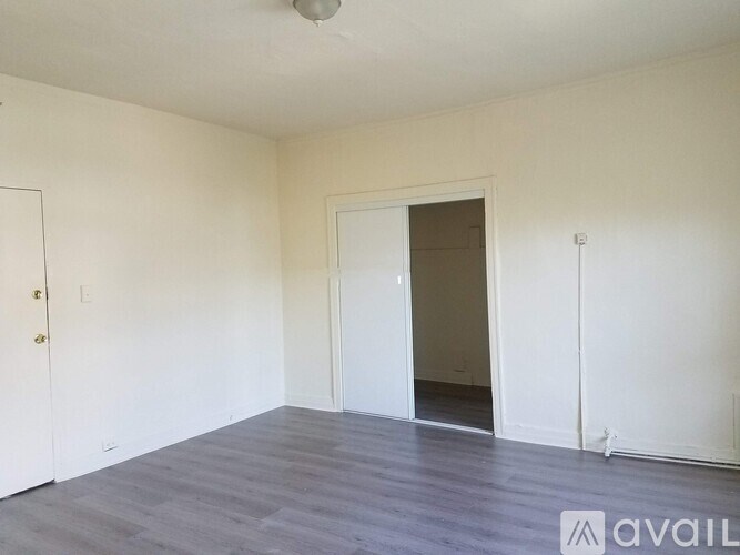 A room with a door and a window.