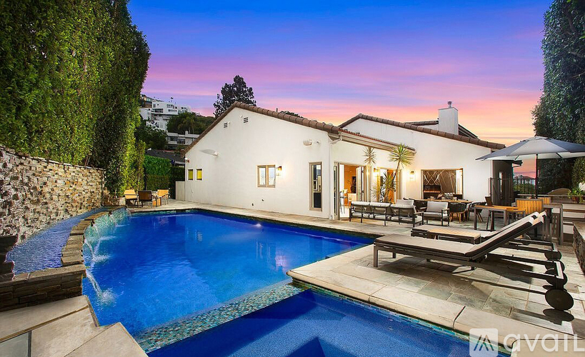 A house with a pool in the backyard.