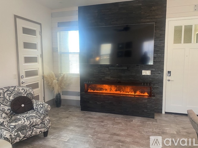 A living room with a fireplace and a couch.