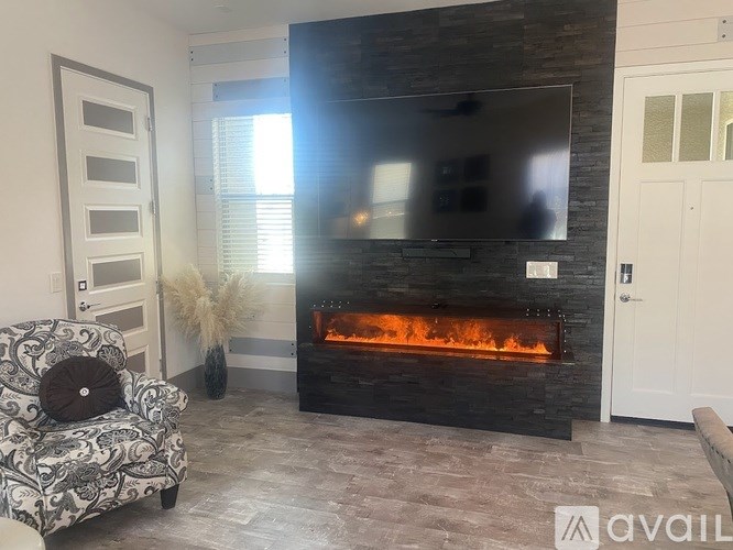 A living room with a fireplace and a couch.