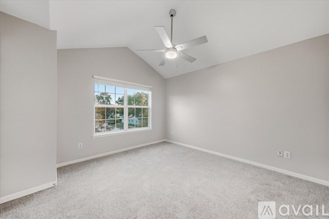 A room with a doorway leading to another room, a window on the right, and a floor with some debris.