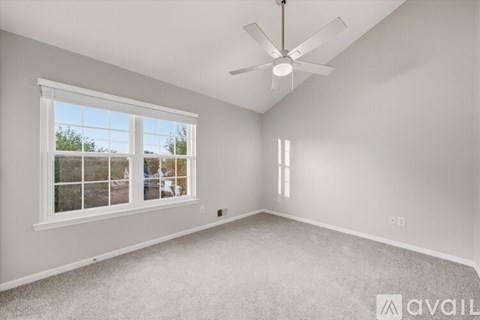 A white bathroom with a tub, toilet and sink.