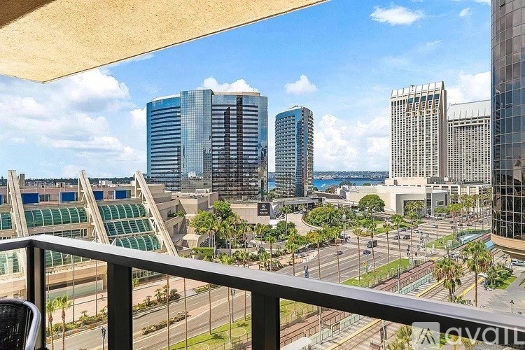 A cityscape with tall buildings and a clear sky.