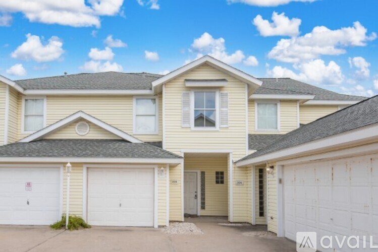 A two-story house with a garage is available for rent.