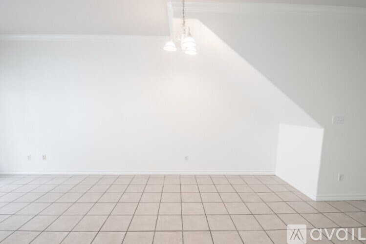 A room with white walls and a tiled floor.
