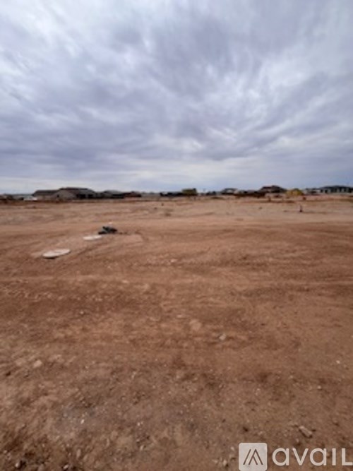 A barren landscape with a cloudy sky.