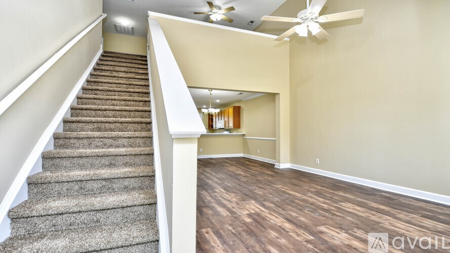 A room with a staircase leading to the upper floor.