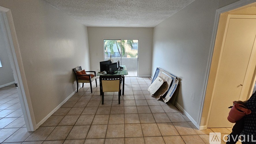 A room with a table and chairs in it.