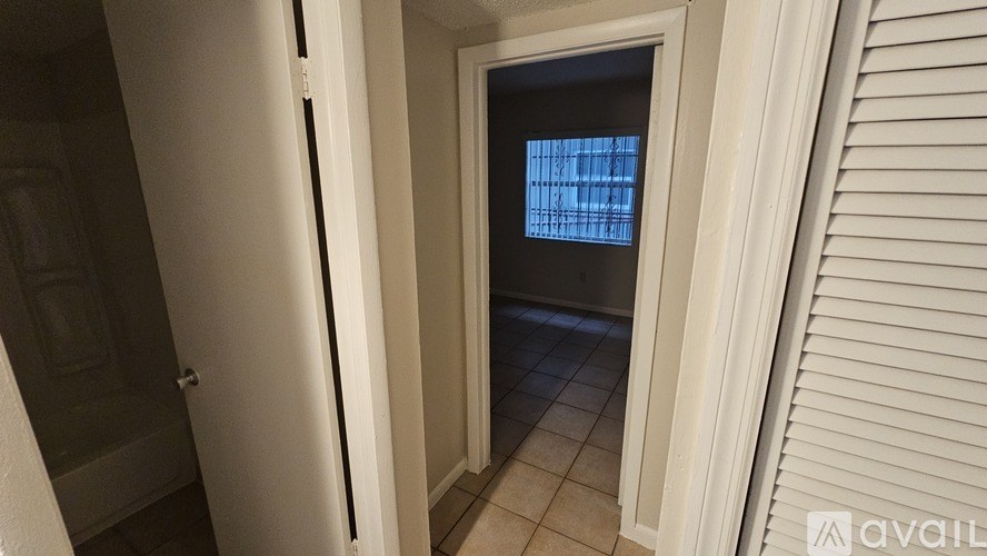 A white door with a window in the middle.
