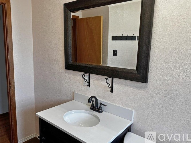 A bathroom sink with a mirror above it.