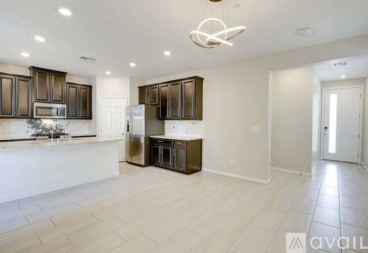 A kitchen with brown cabinets and a white countertop.