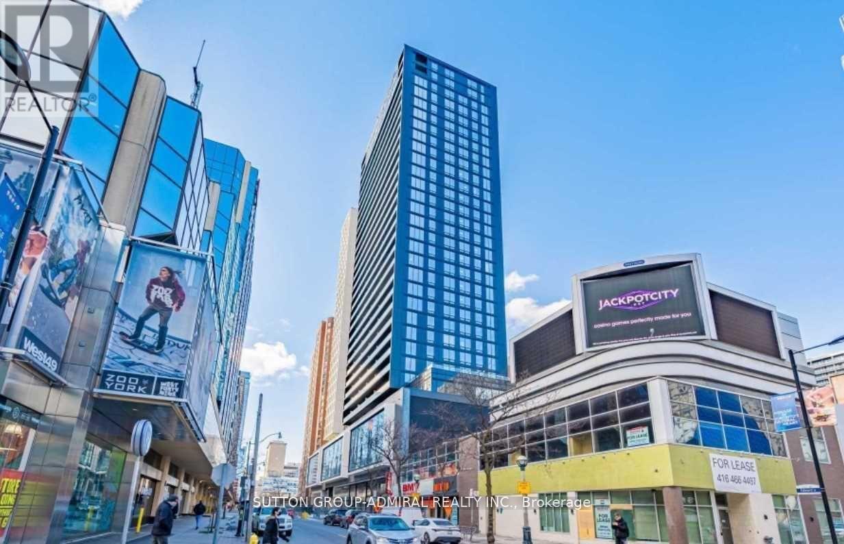 A city street with a tall building and a sign that says "Jackpot City".