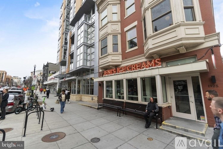 A street view of a building with the sign "Ice Creams" on it.