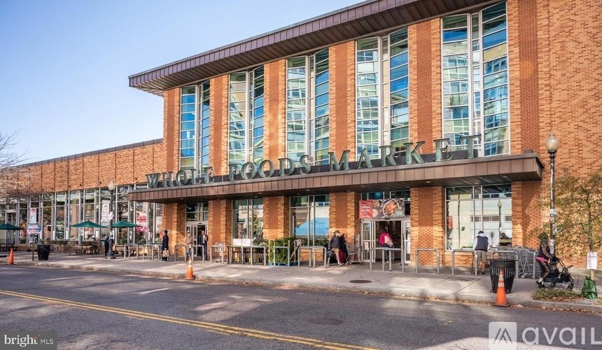 A large building with a glass facade and a brick exterior.