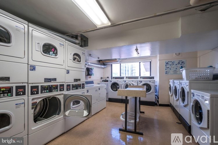 A laundromat with rows of washers and dryers.