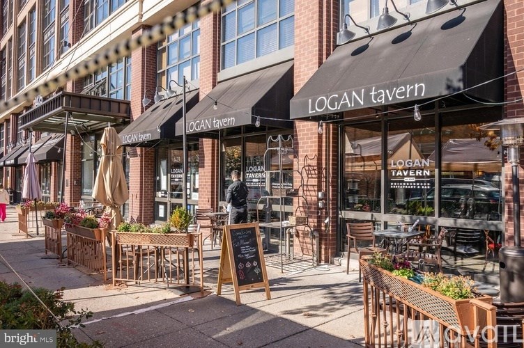 A street view of Logan Tavern with outdoor seating.