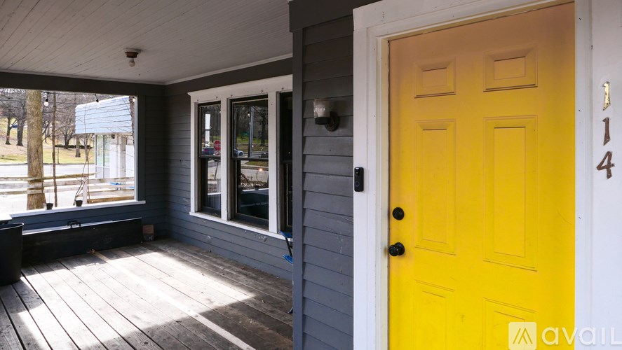 A yellow door is on the right side of the image.