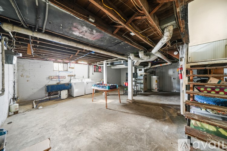 A room with a table and chairs in it.