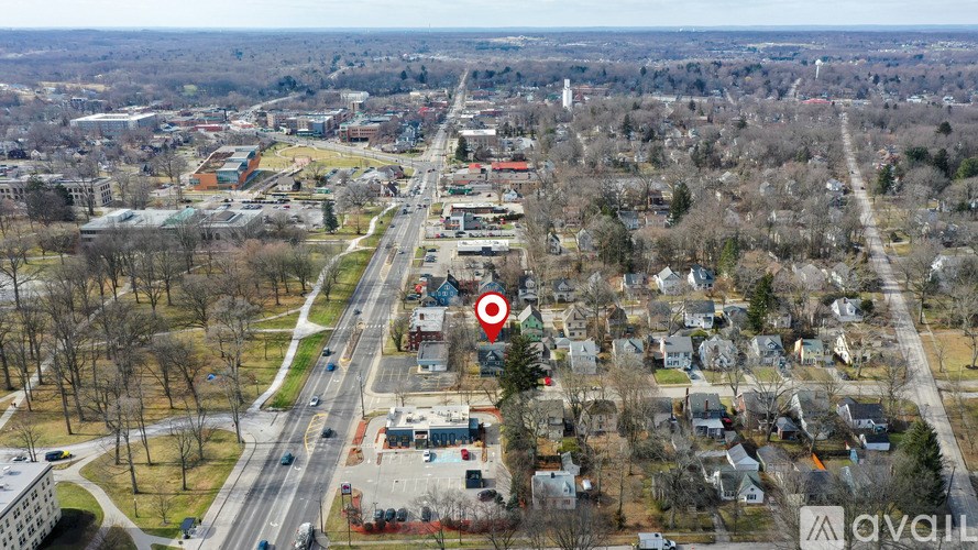 A bird's eye view of a residential area with a red target in the middle.