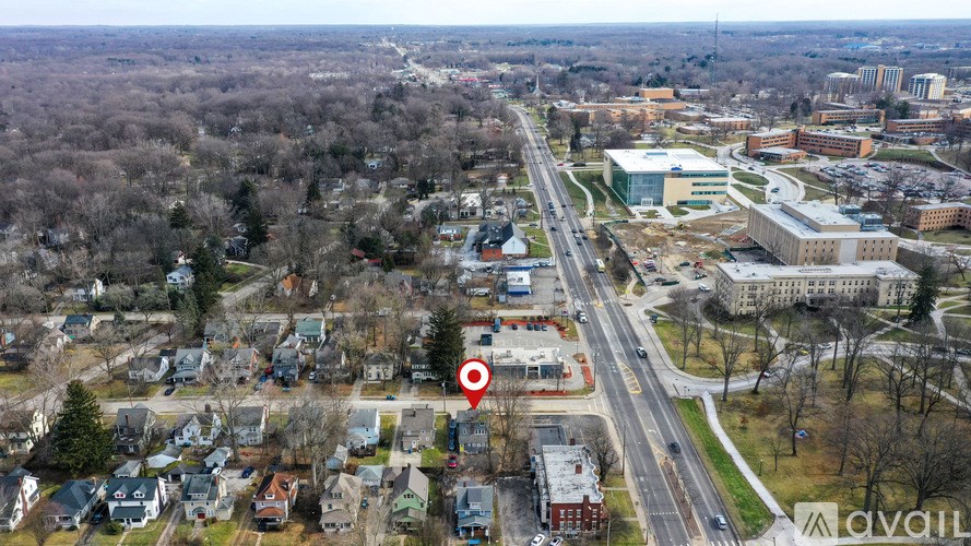 A red marker is placed on a building in a small town.