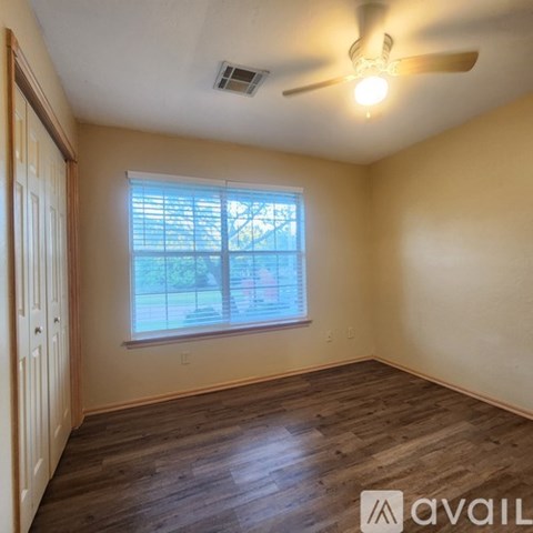 A room with a door and a wall with a number 27 on it.