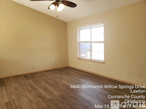 A room with a ceiling fan and a window at 6840 Northwest Willow Springs Drive, Lawton, Comanche County, Oklahoma.