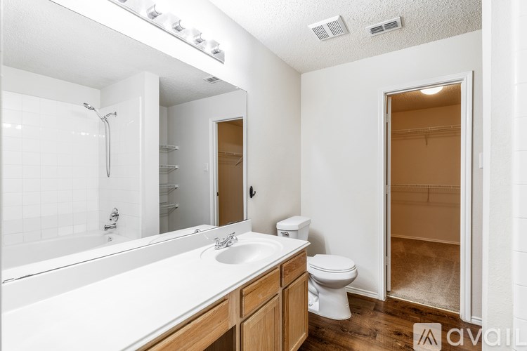 A bathroom with a white toilet and sink.