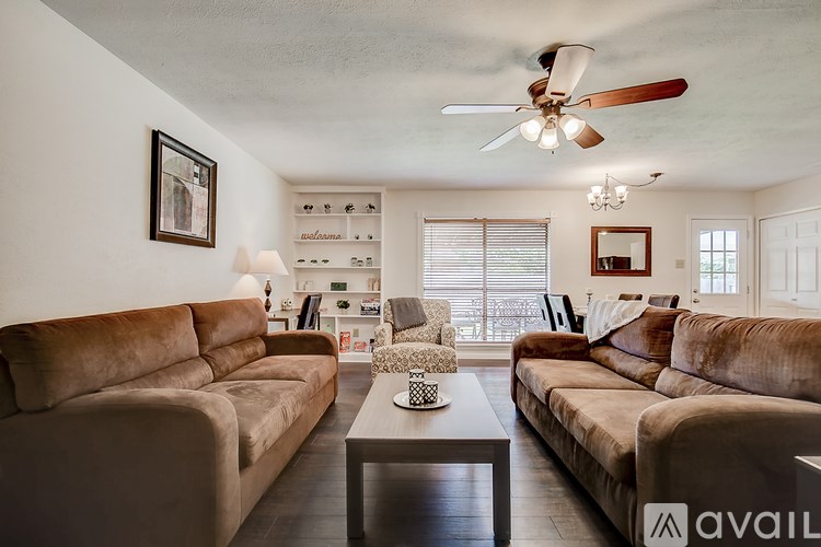A living room with two couches and a coffee table.