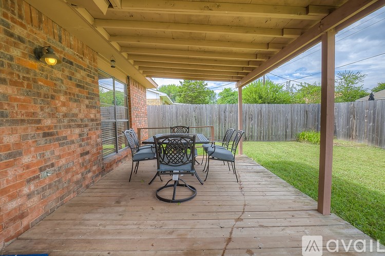 A patio with a table and chairs is available for rent.