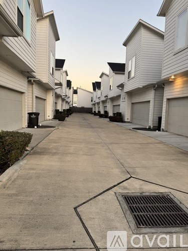 A row of houses with a street in between.