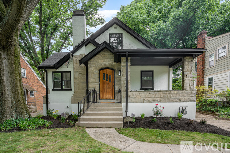 A house with a brown door and a white front porch.