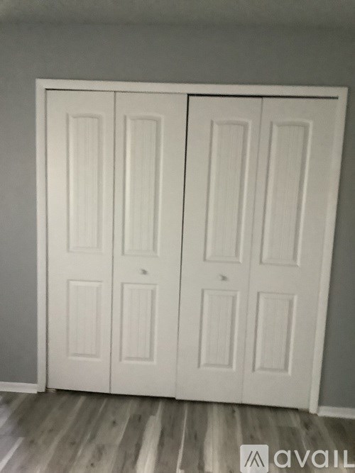 A white double door with a panel design.