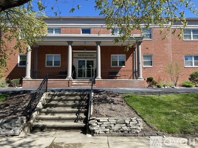 A brick building with a sign that says "The Boulevard" on it.