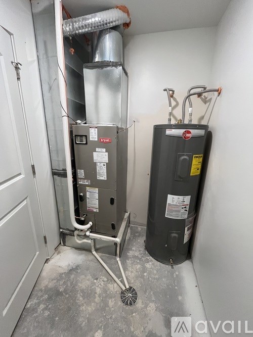A wall-mounted furnace and air conditioner unit in a small room.