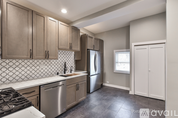 A kitchen with a stove top oven and a dishwasher.