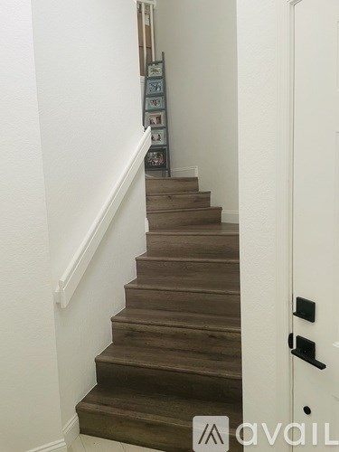 A bathroom vanity with a sink and mirror.