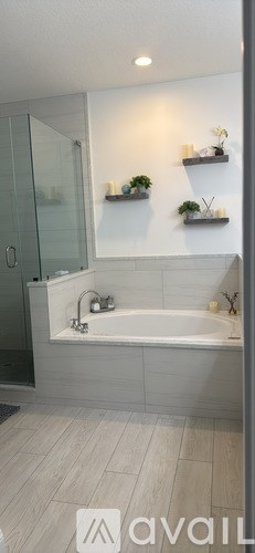A dining room with a wooden table and chairs.