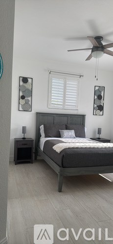 A dining room with a table and chairs.