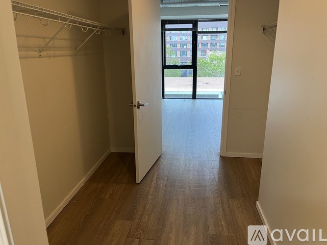 A room with a door leading to a balcony.